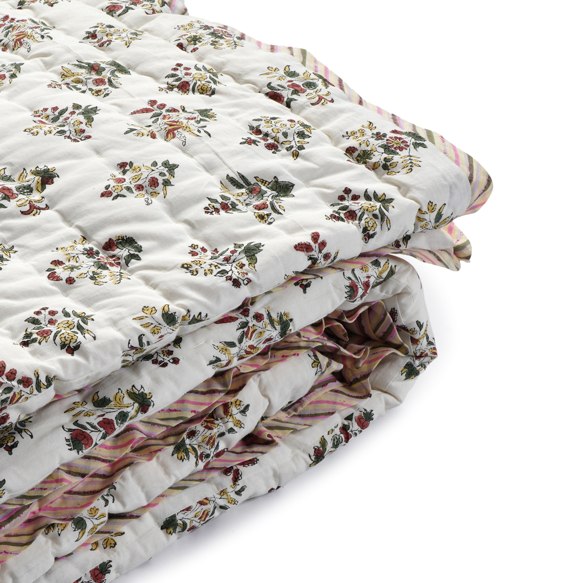 Floral patterned quilt on a white background