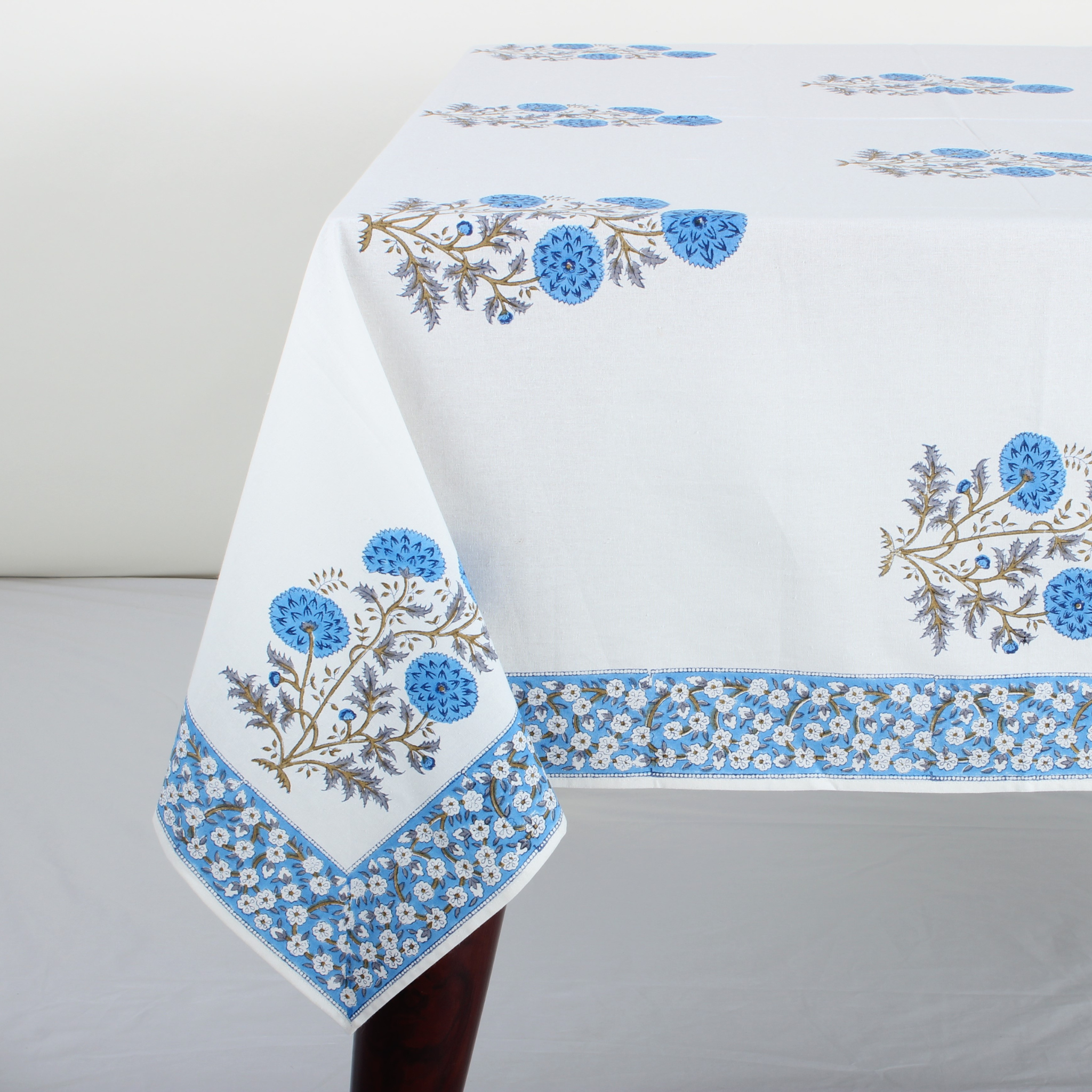 Tablecloth with floral embroidery on a gray background