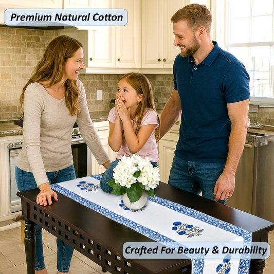 Family in a kitchen with a table runner featuring white flowers and blue patterns.