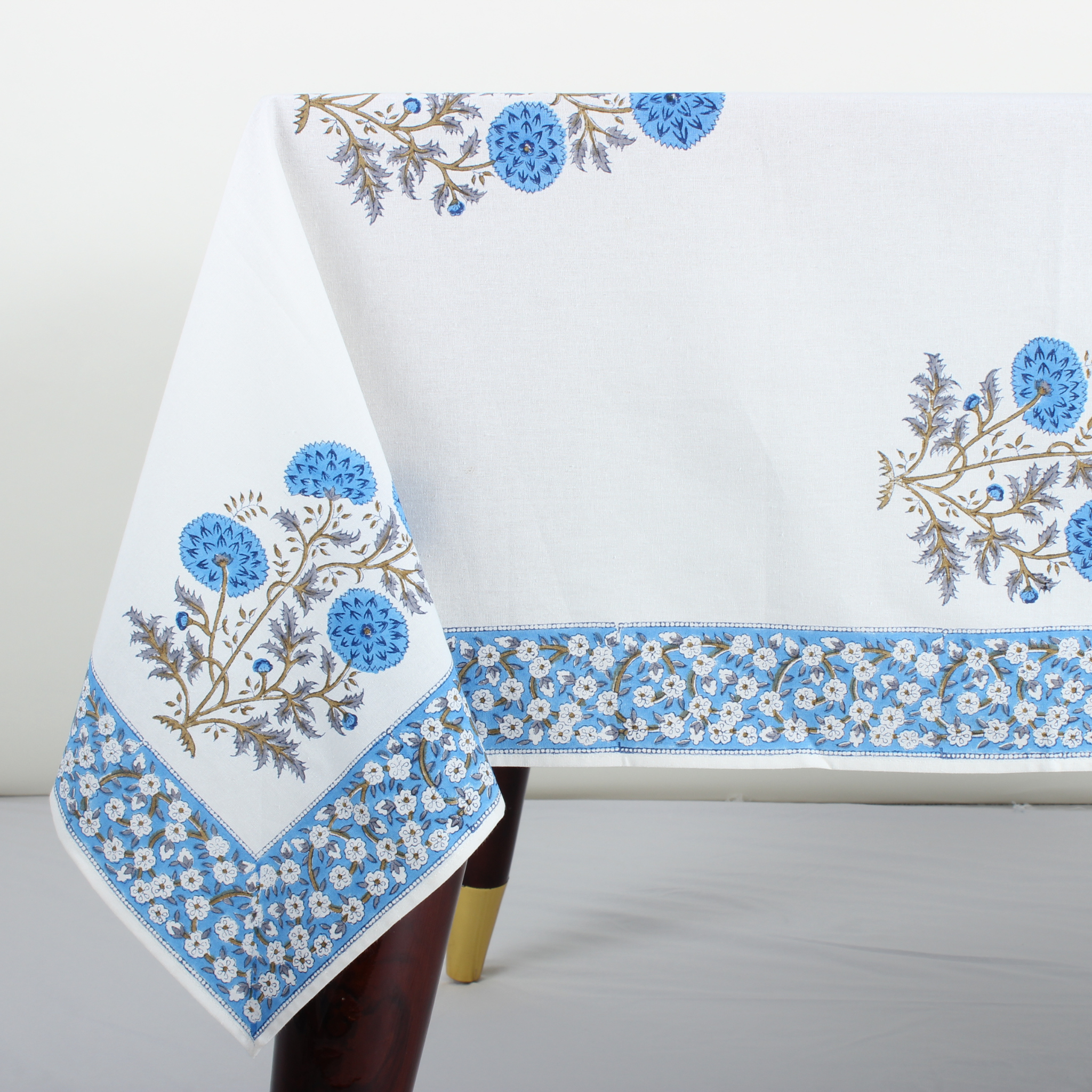 Decorative tablecloth with floral patterns on a white background