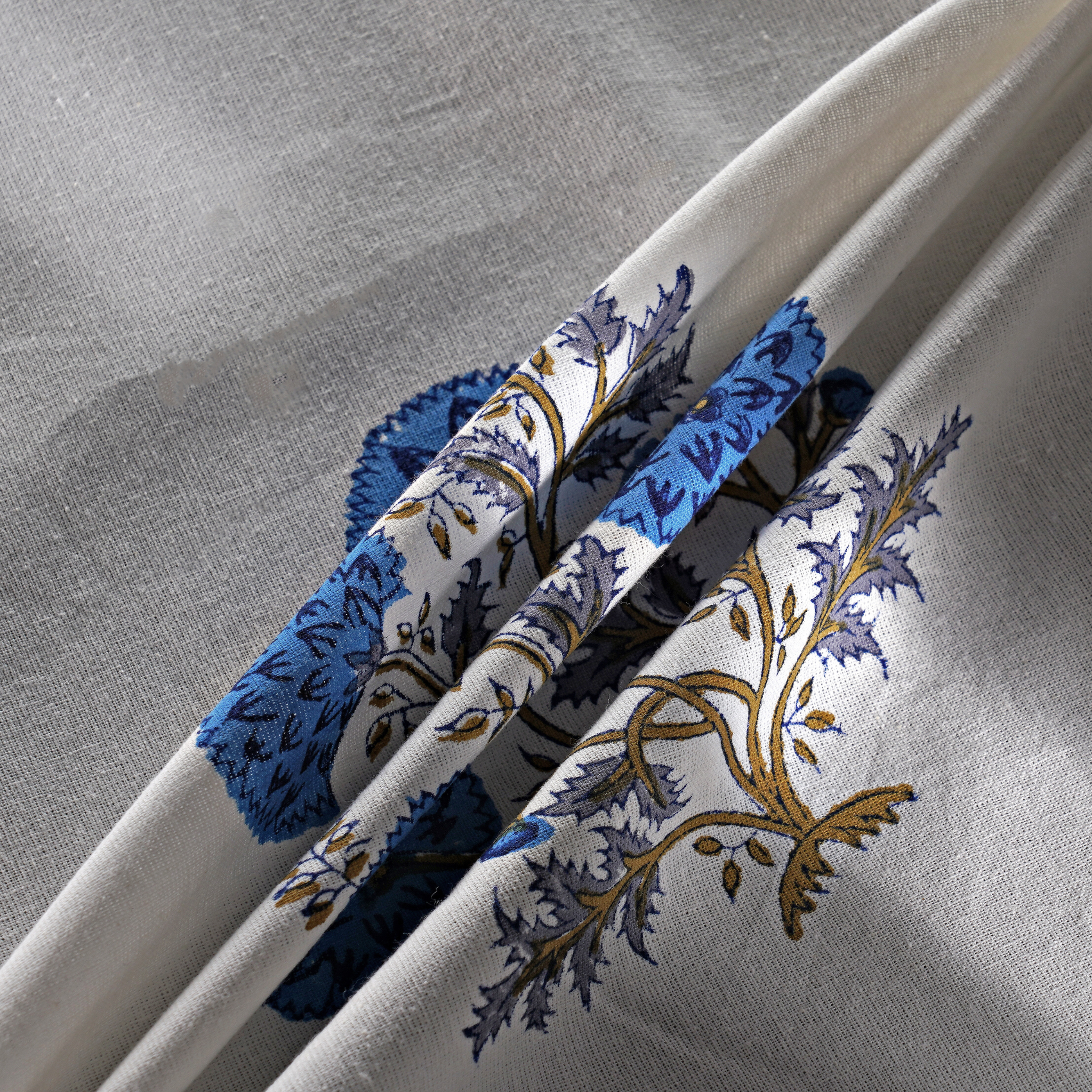 Decorative headbands with floral patterns on a gray background