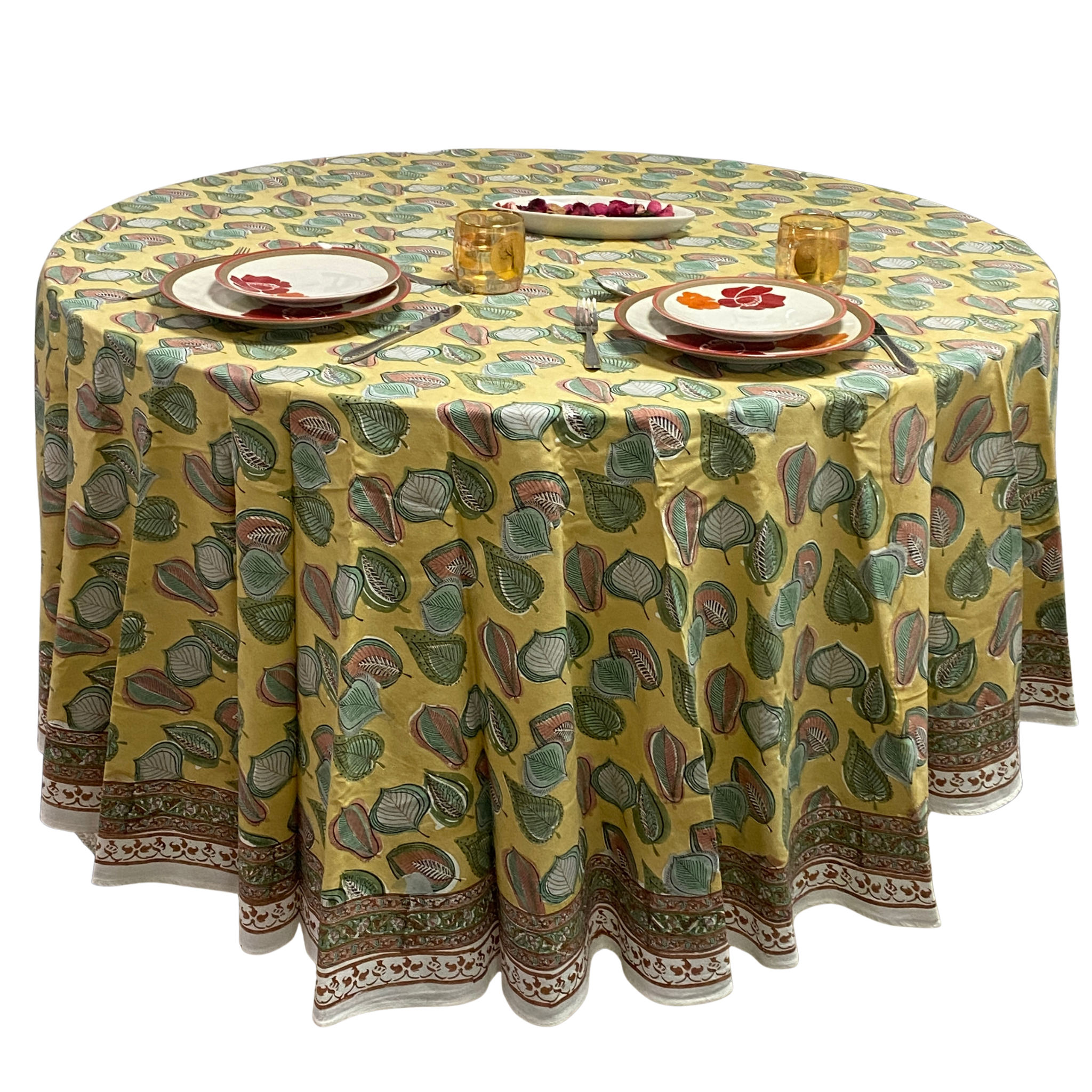Round tablecloth with a colorful leaf pattern on a white background