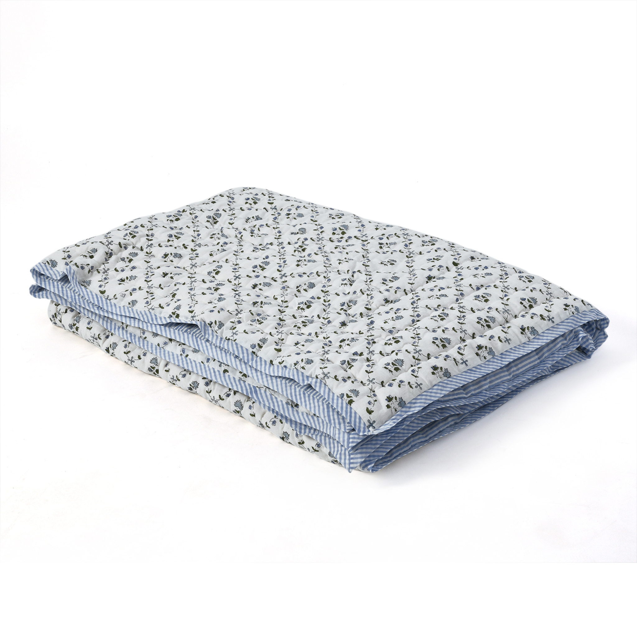 Folded fabric with floral and striped patterns on a white background