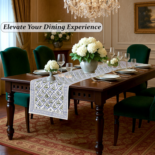 Dining room with a table set for dinner, flowers, and a chandelier.