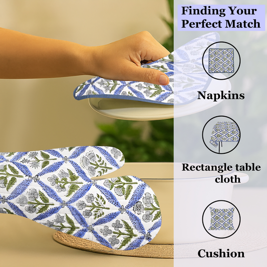 Patterned tablecloth, napkins, and cushion with matching design on a neutral background.