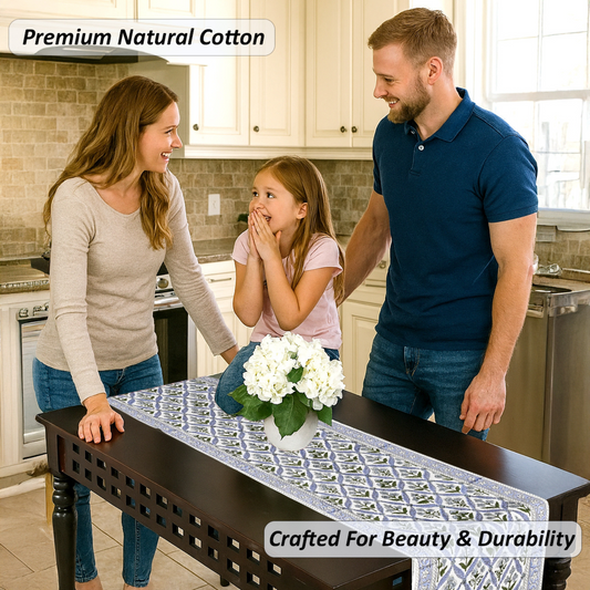 Family in a kitchen with a table runner featuring white flowers.