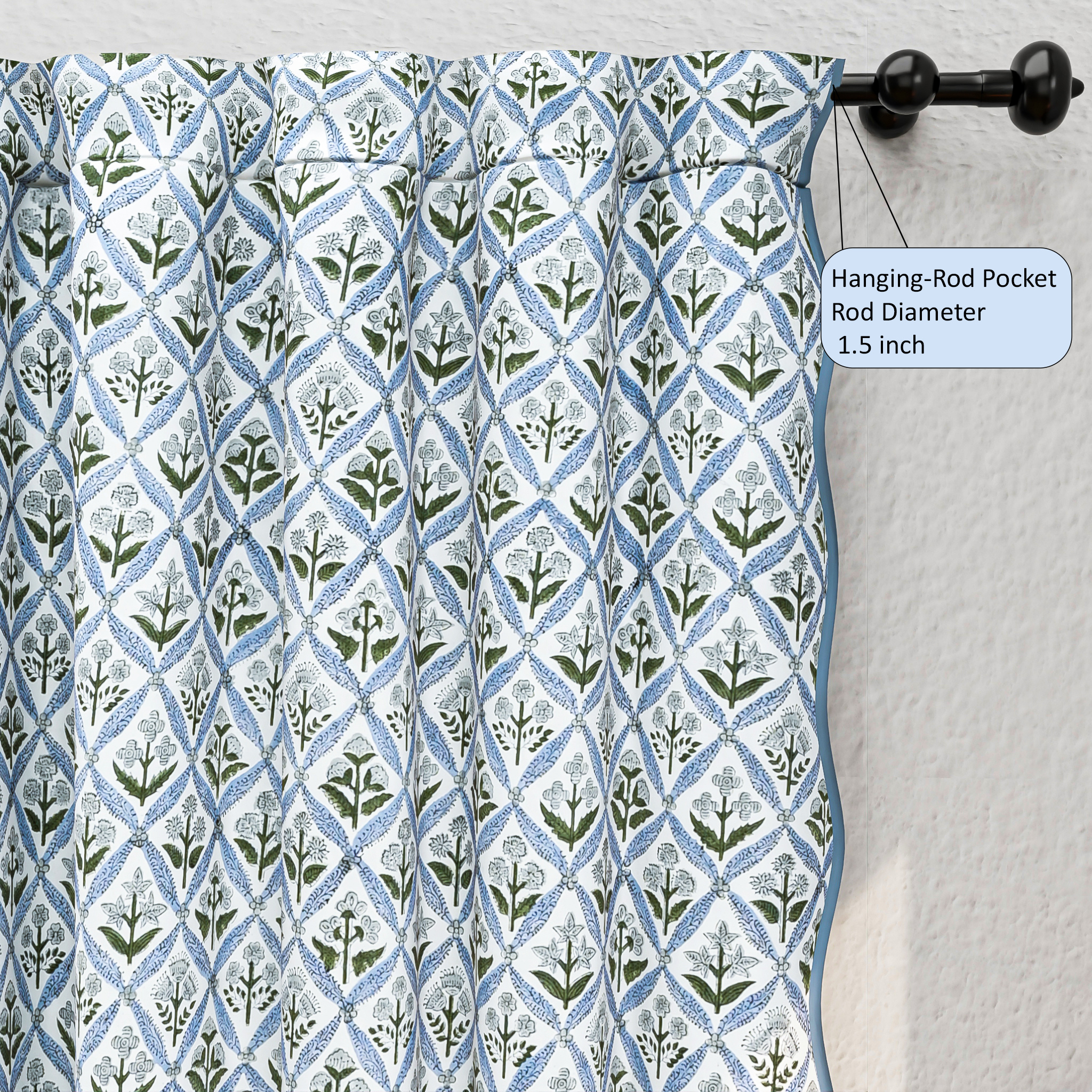 Curtain with geometric pattern hanging on a rod against a white wall