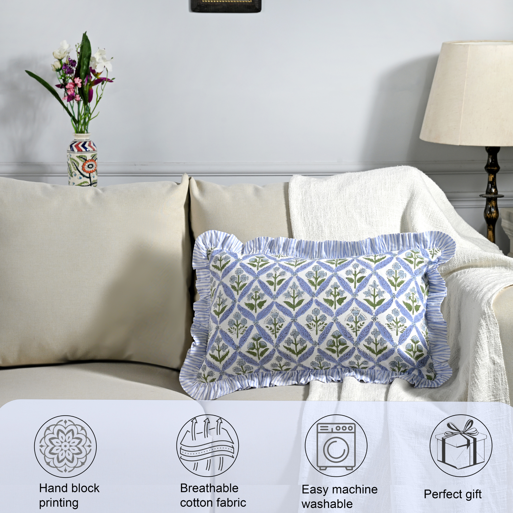Decorative pillow with geometric pattern on a sofa, featuring icons and text about product features.
