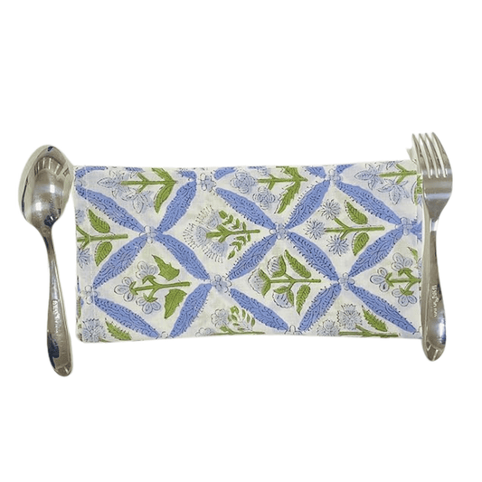 Patterned knife roll with spoon and fork on a white background