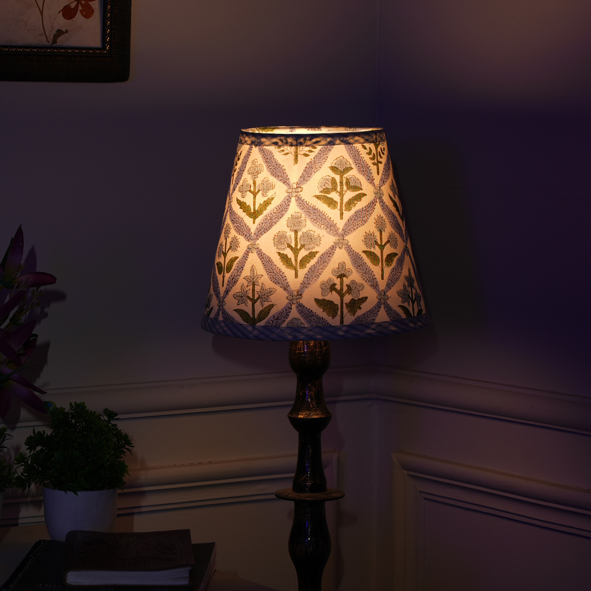 Decorative lamp with floral pattern on a dark background