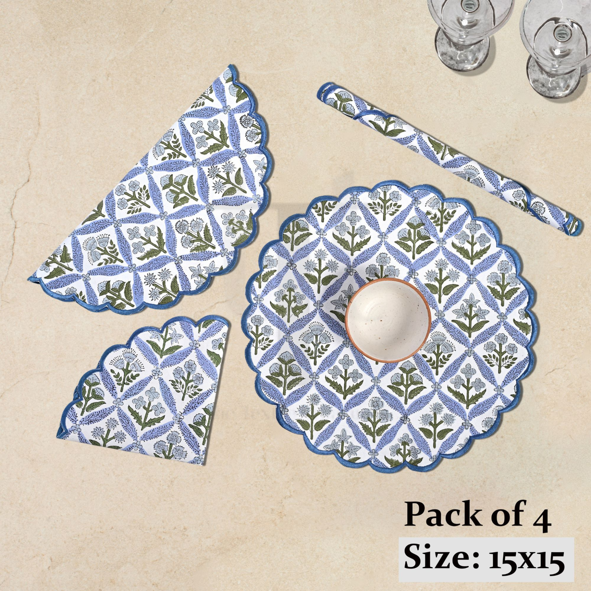 Pack of 4 blue and white patterned placemats on a beige background