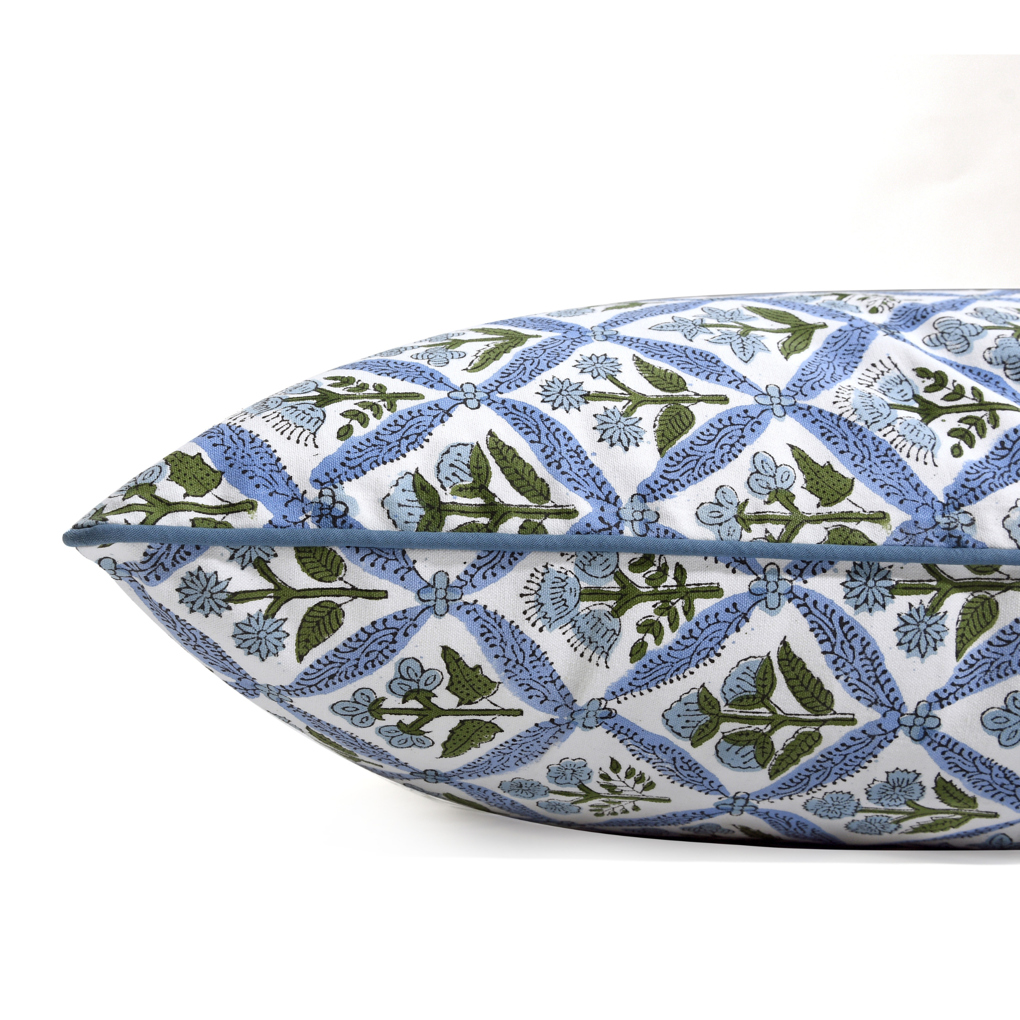 Decorative pillow with blue and green floral pattern on a white background