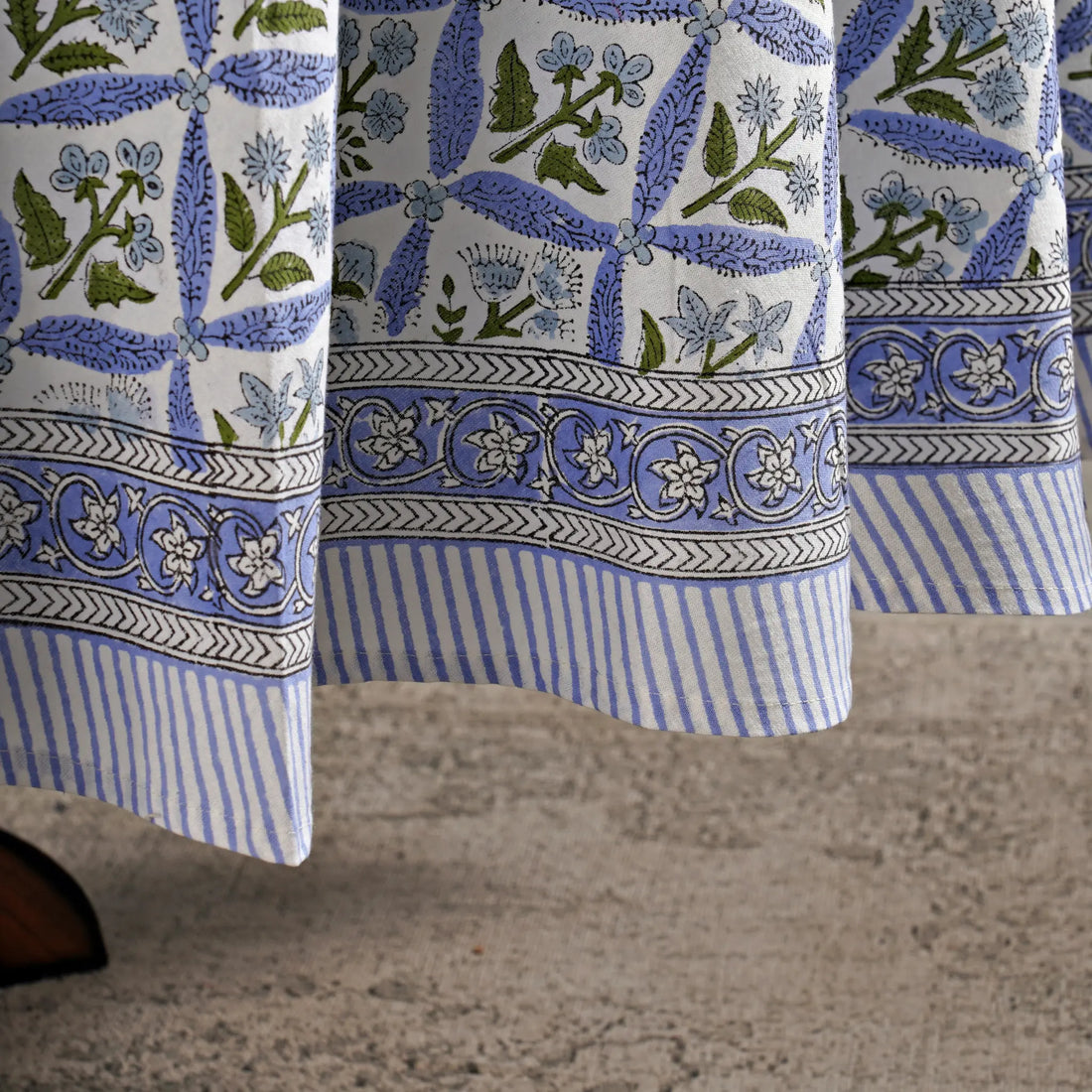 Blue and white patterned fabric draped over a surface
