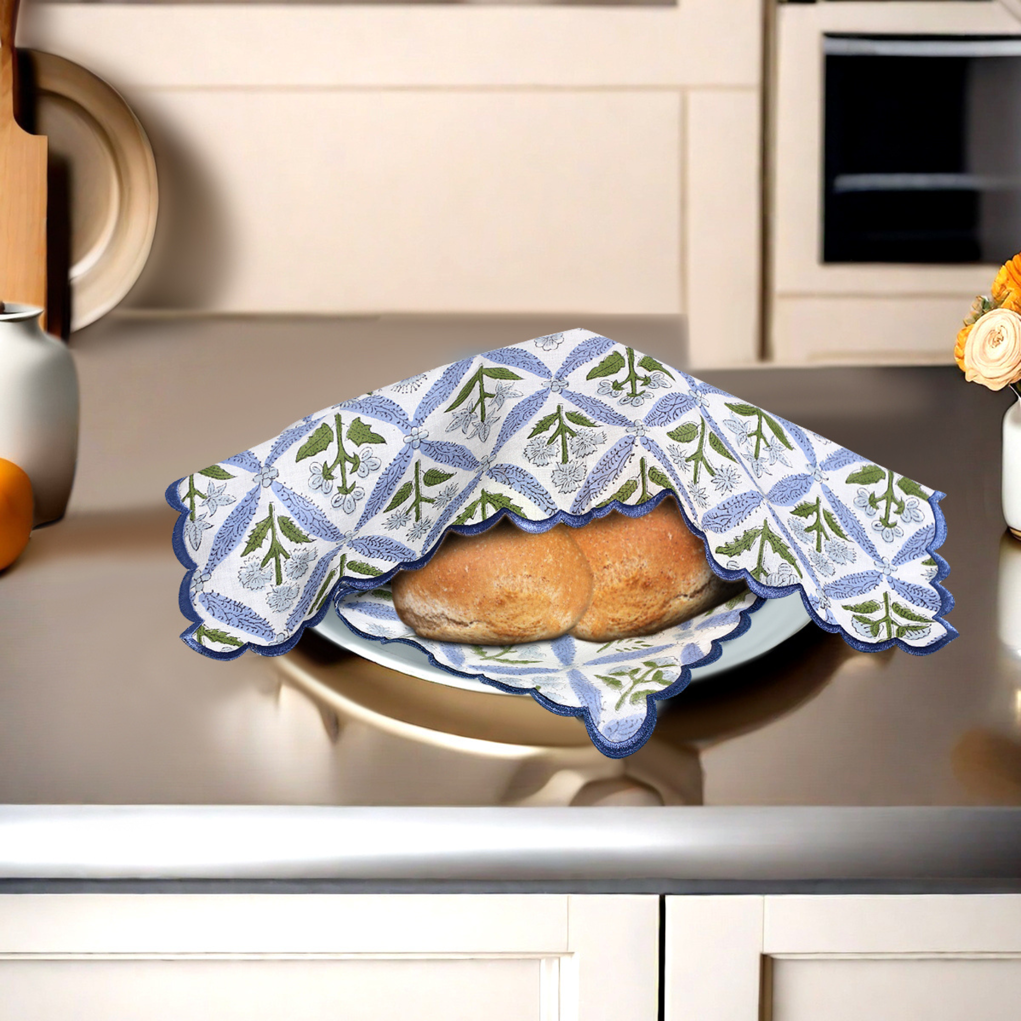 Baked goods on a plate with a decorative cloth in a kitchen setting