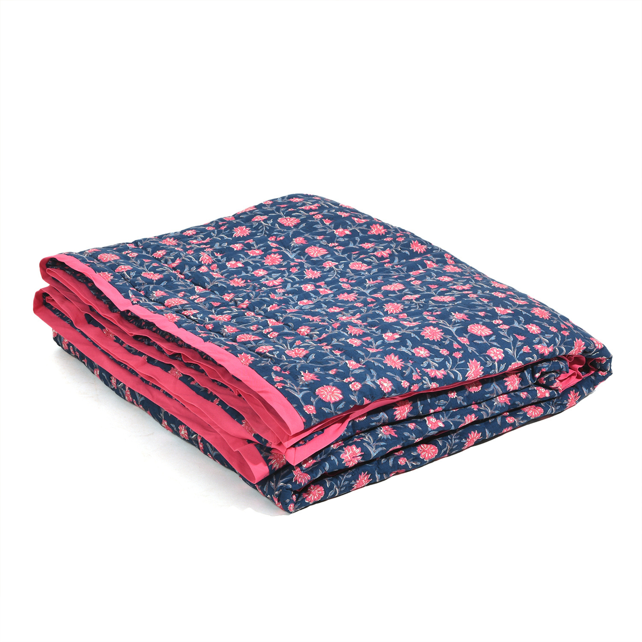 Folded blanket with pink floral pattern on a white background