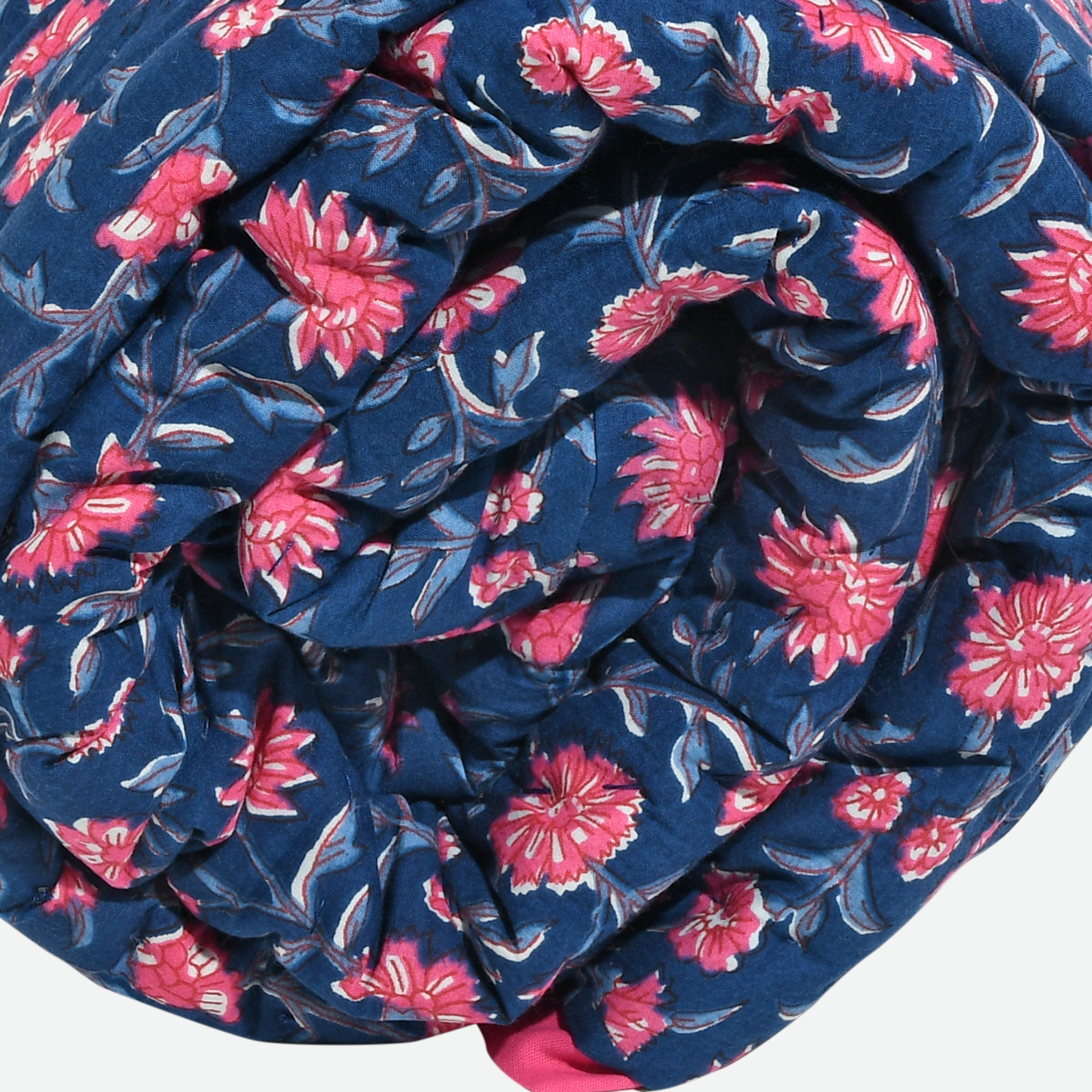 Roll of blue fabric with pink floral pattern