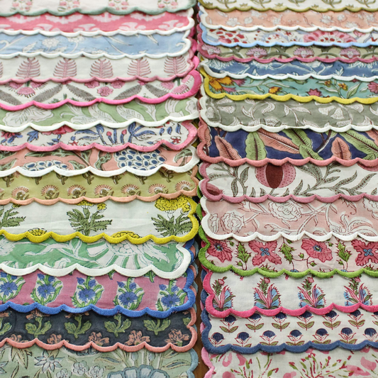 Stack of colorful scalloped fabric samples