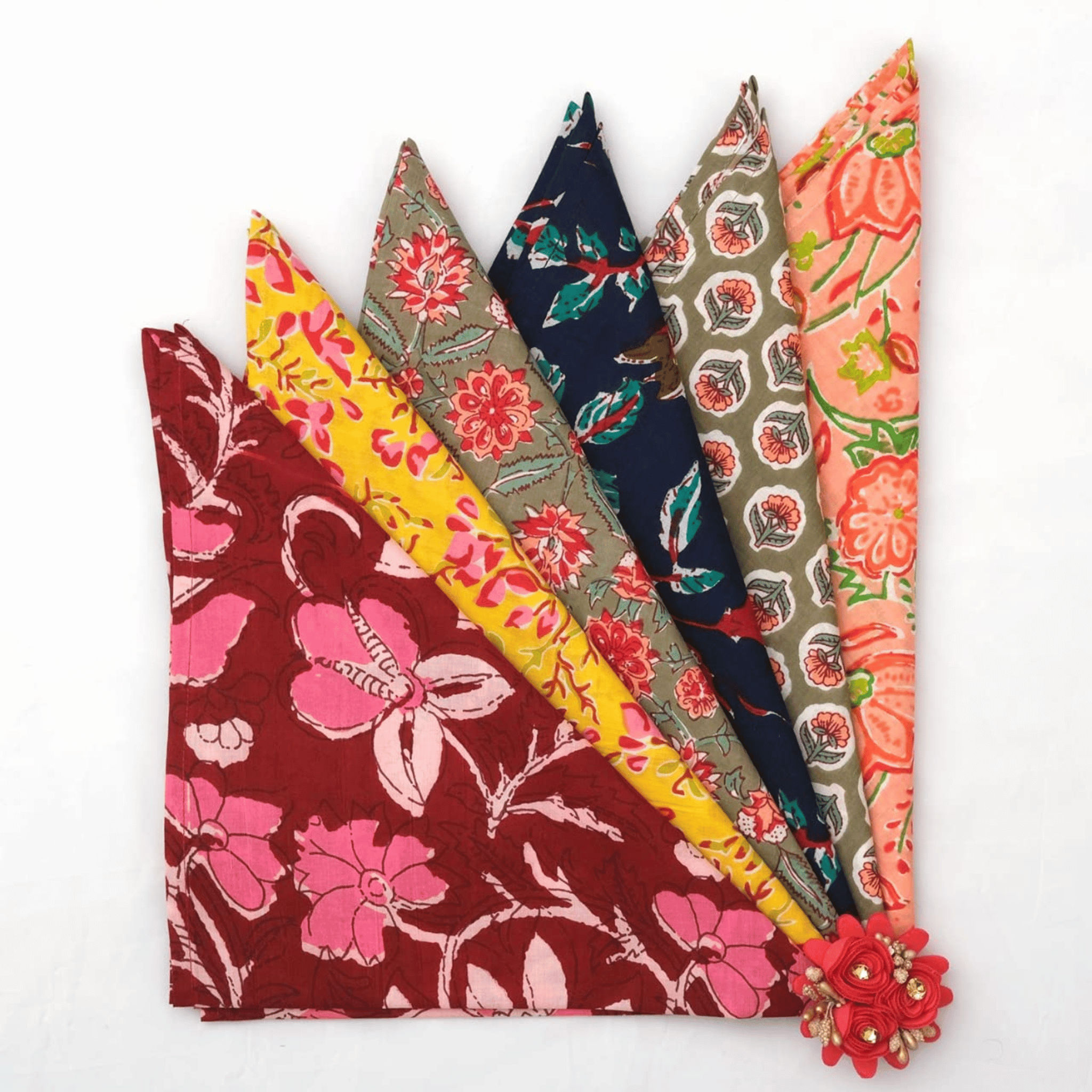 Set of colorful fabric swatches with floral patterns on a white background