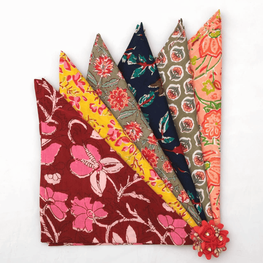 Set of colorful fabric swatches with floral patterns on a white background