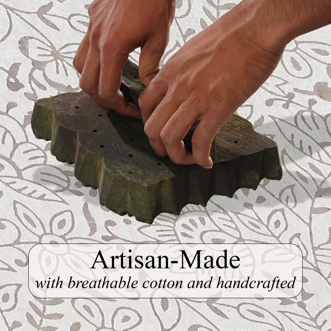 Hands using a textured green object with a floral patterned background