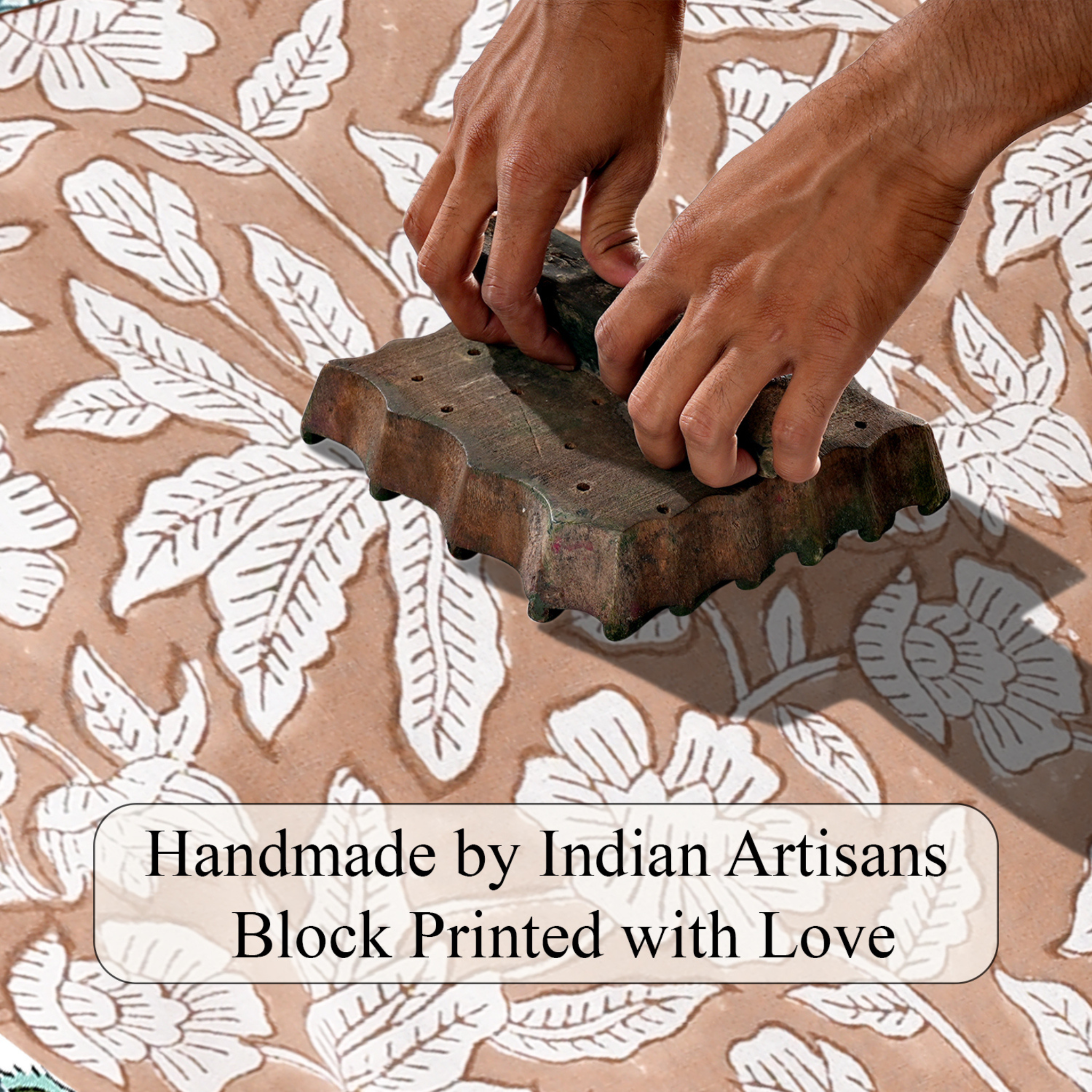 Hand block printing on fabric with text 'Handmade by Indian Artisans Block Printed with Love'.