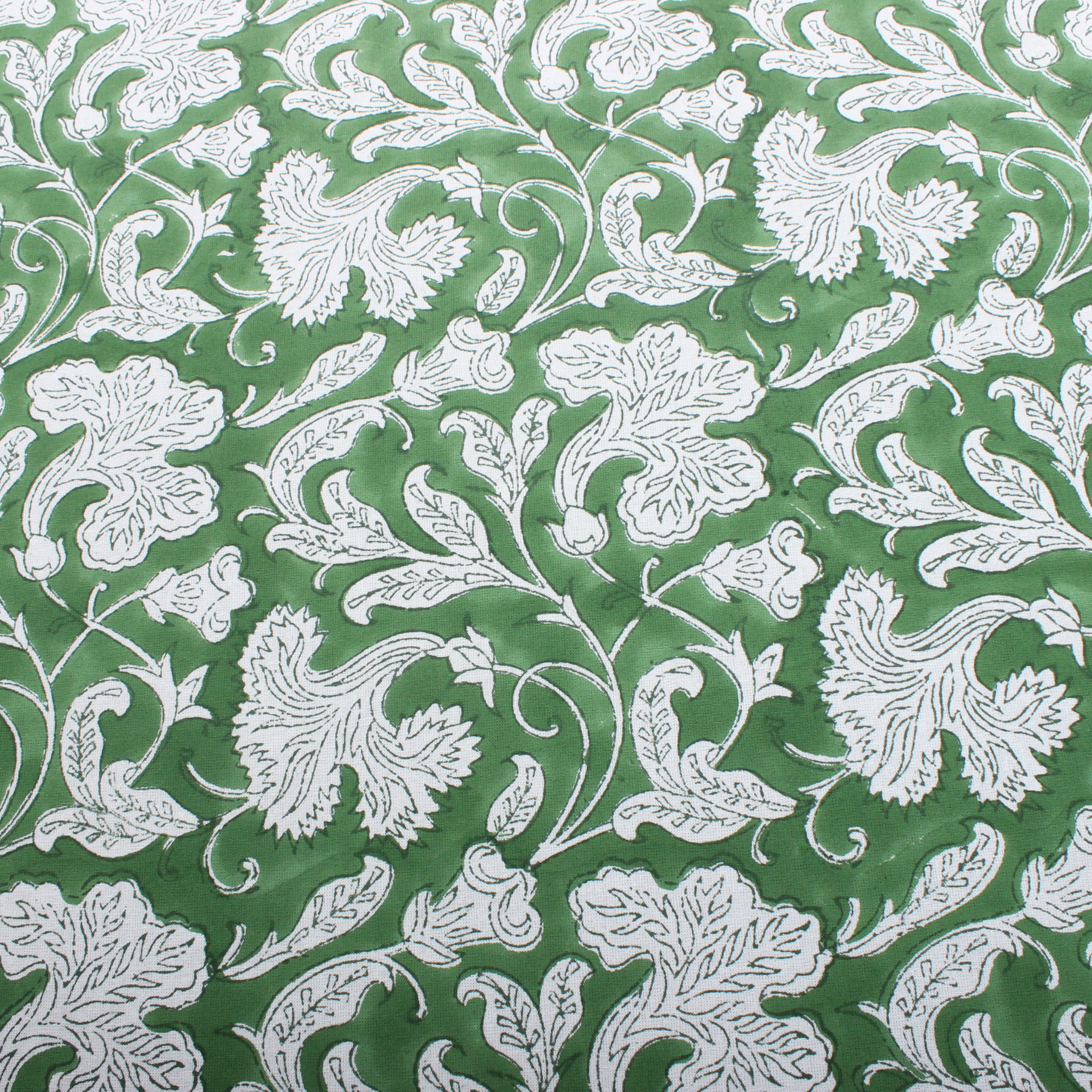 White floral pattern on a green background