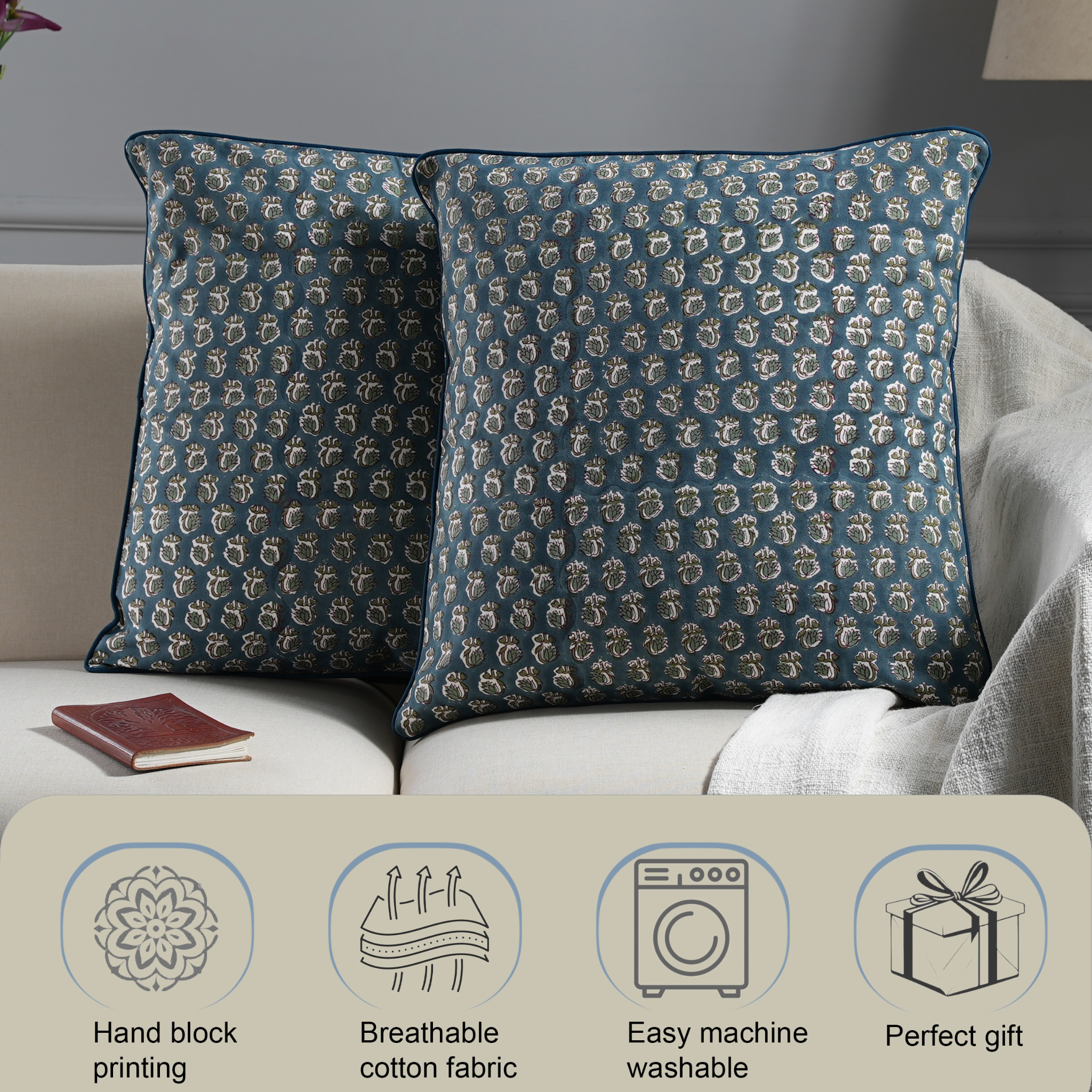 Two patterned pillows on a sofa with product features displayed below.