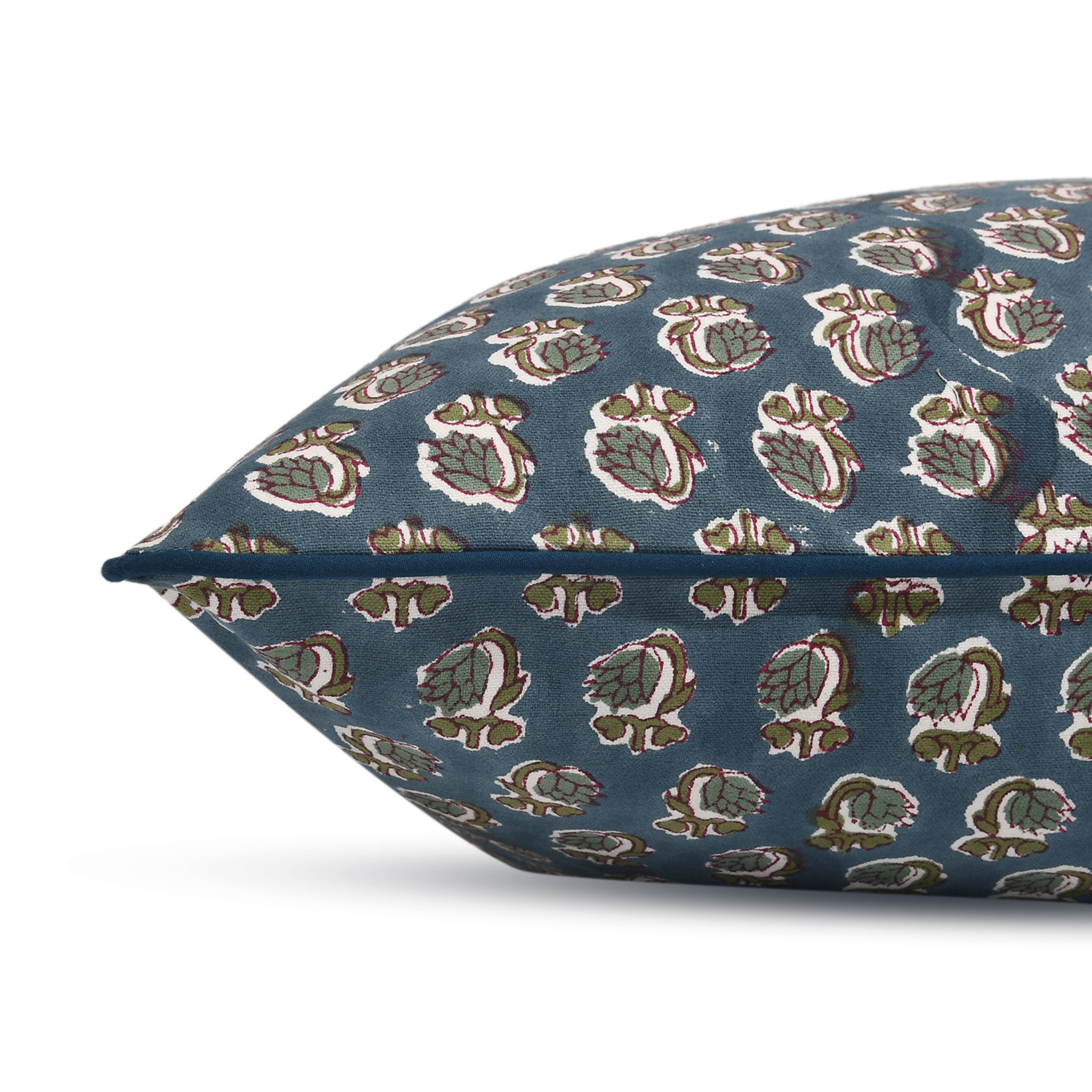 Decorative pillow with a floral pattern on a blue background