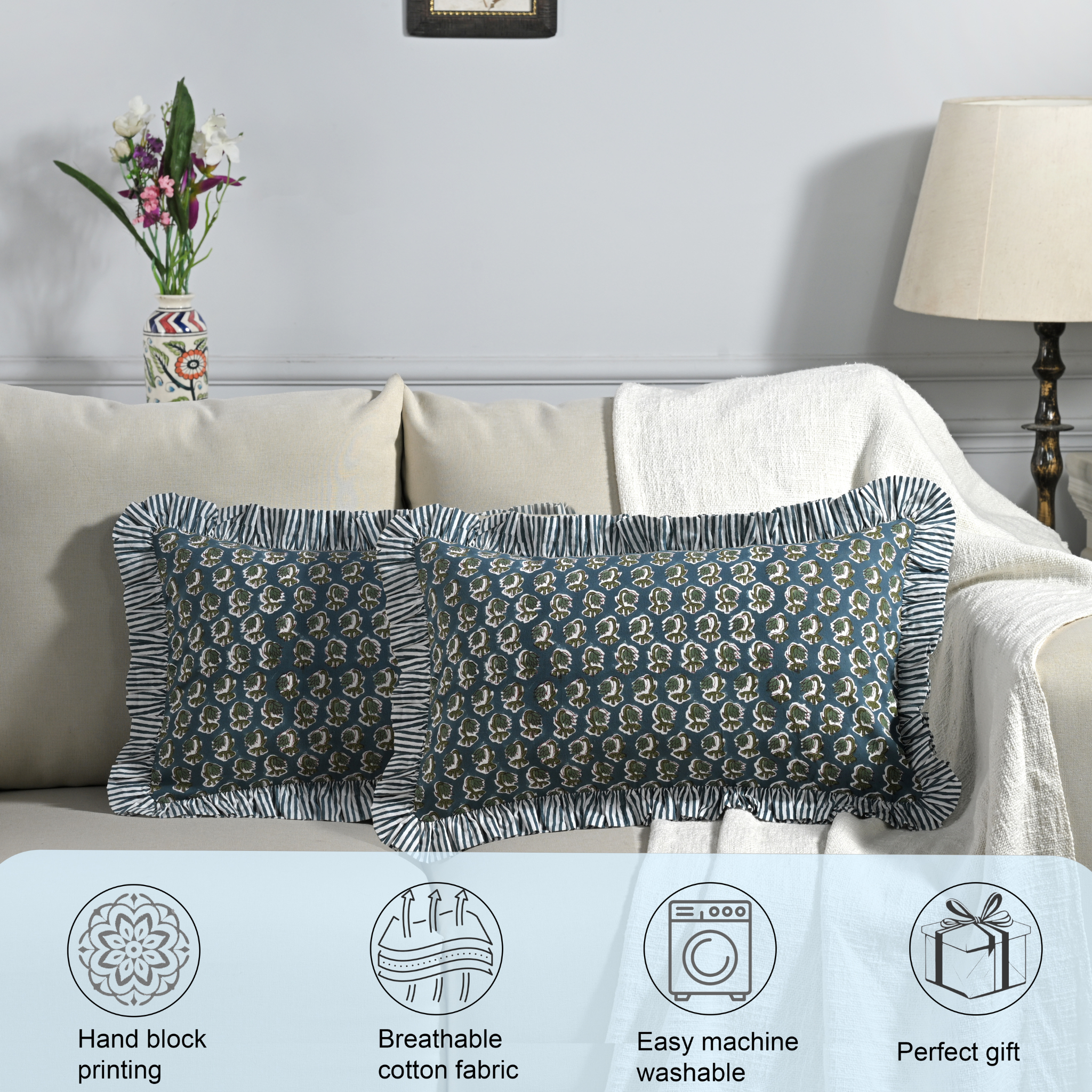 Decorative pillows on a sofa with product features displayed below.
