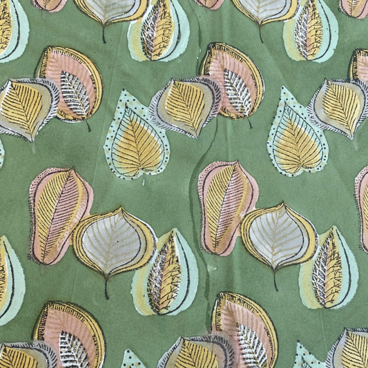 Pattern of stylized leaves on a green background