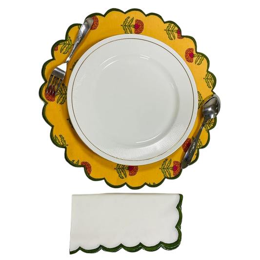 Decorative yellow plate with floral patterns, a white plate, silverware, and a napkin on a white background.