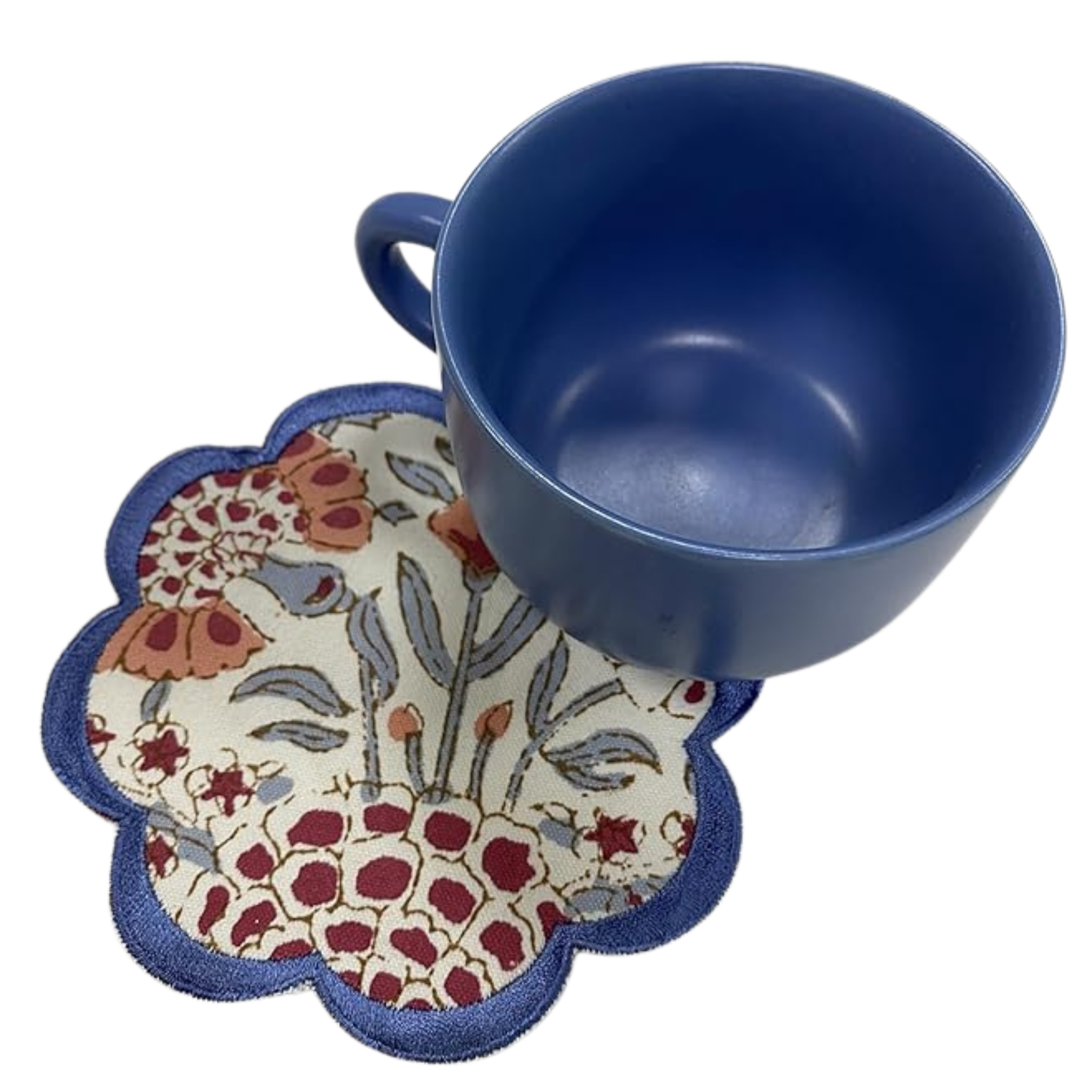 Blue mug on a floral-patterned coaster with a white background