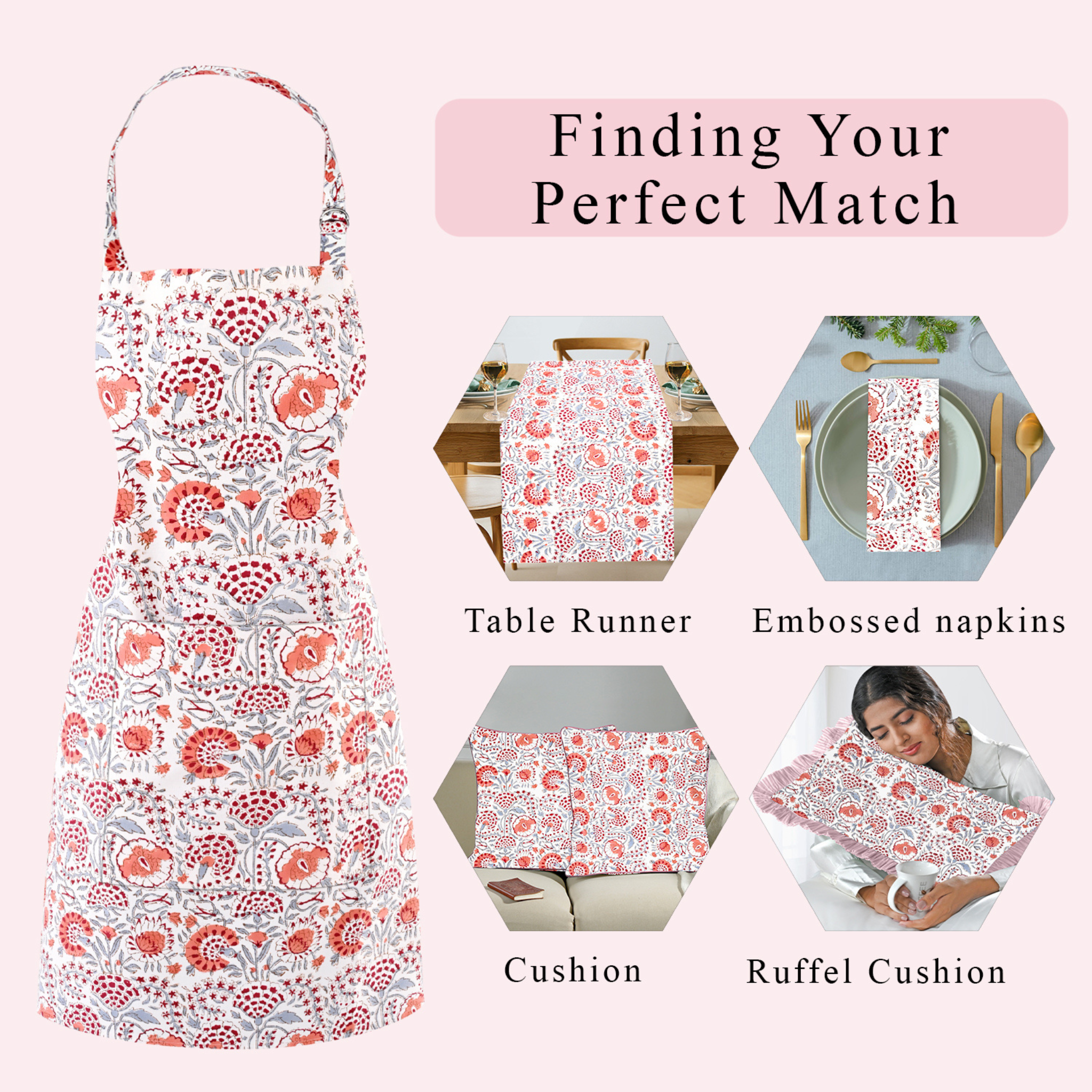 Floral apron with matching table runner, napkins, cushion, and ruffel cushion on a pink background.