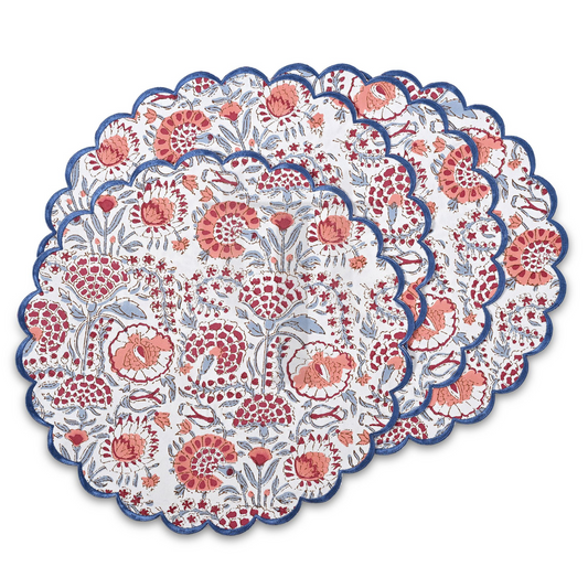 Round floral placemat with red and blue patterns on a white background