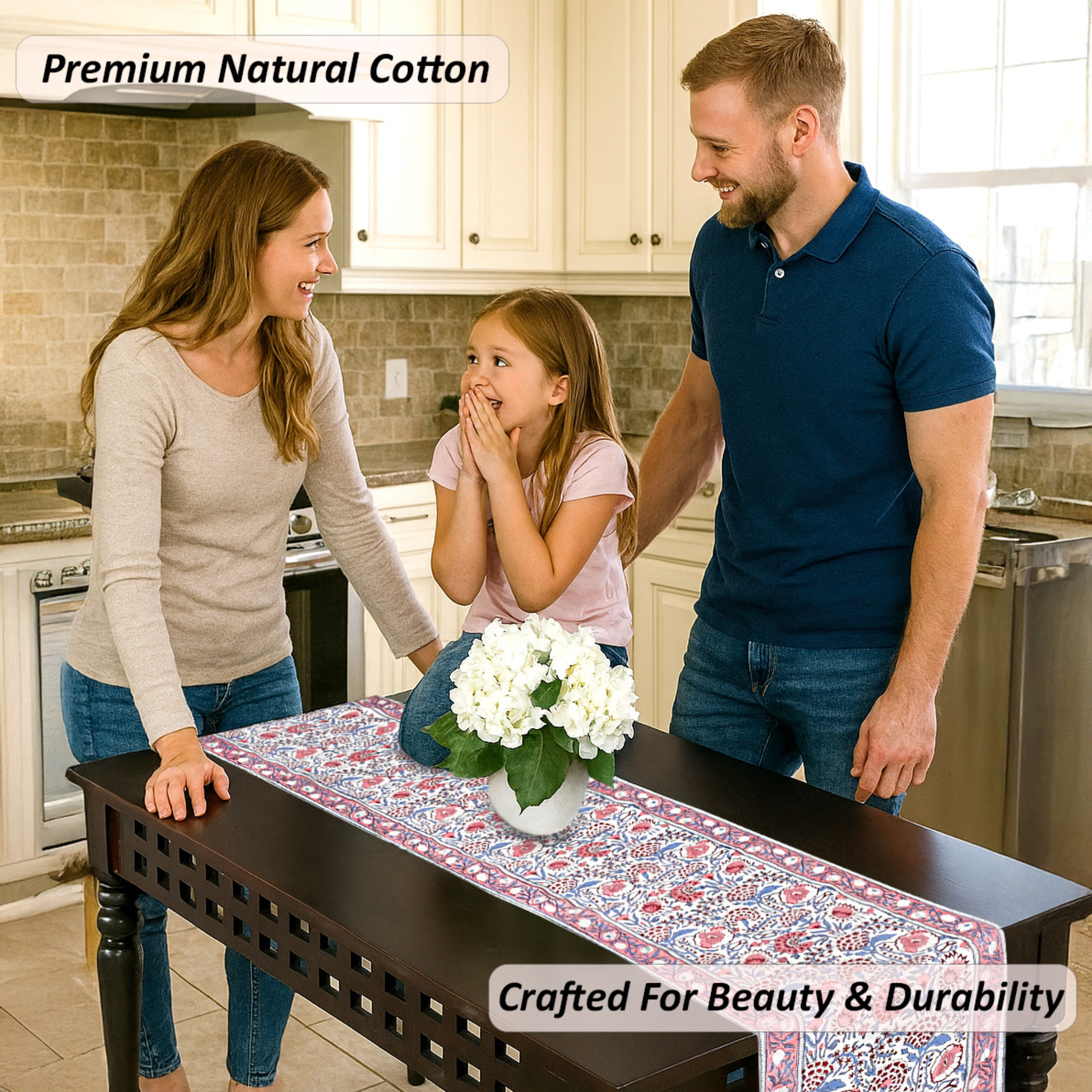 Family in a kitchen with a table runner featuring white flowers.