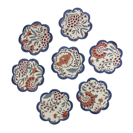 Set of six floral coasters with blue borders on a white background