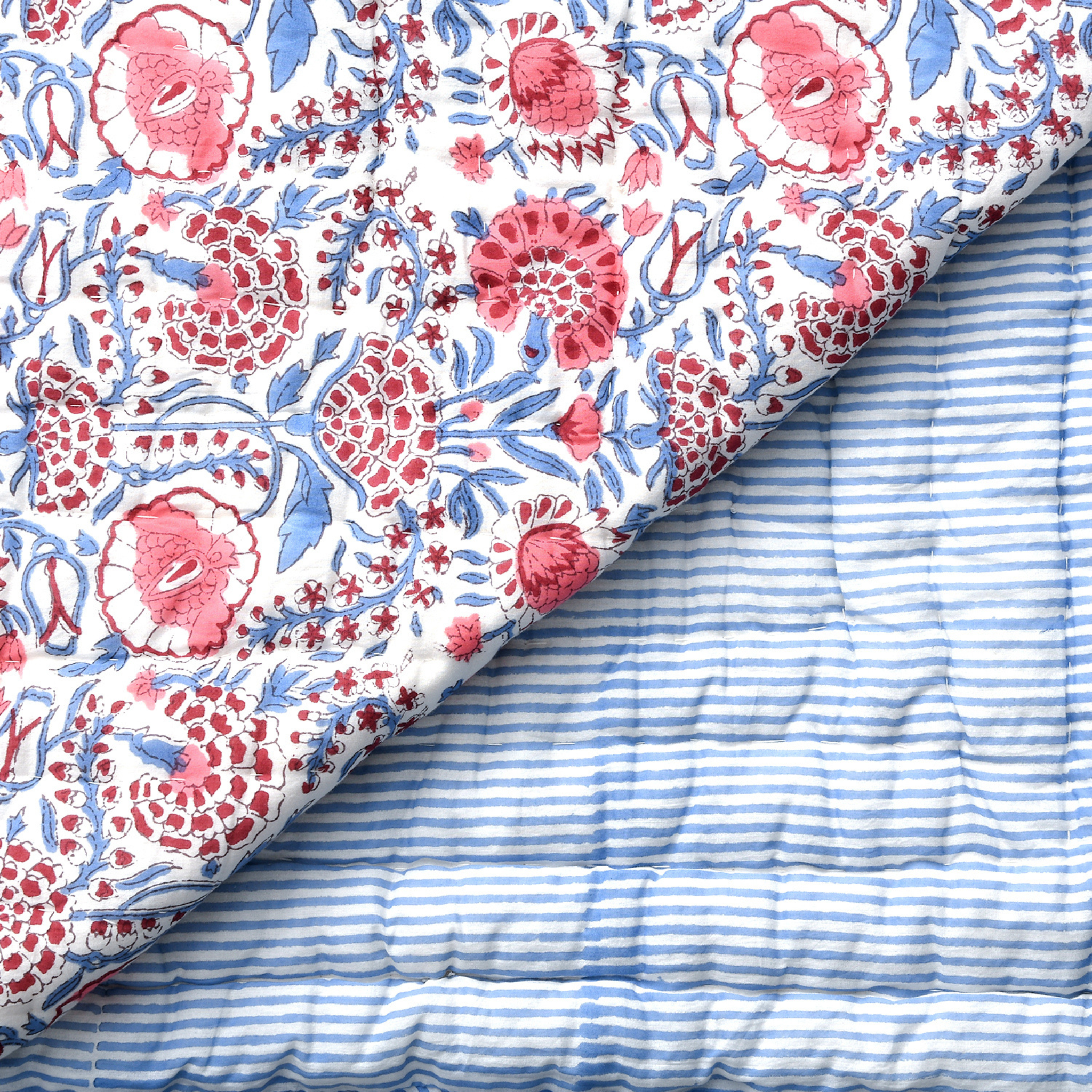 Floral fabric with pink and blue patterns on a white background