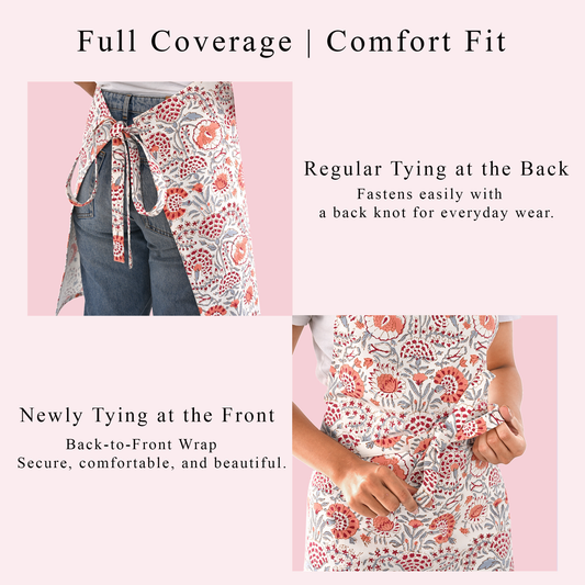 Floral apron with text on full coverage and comfort fit features against a pink background