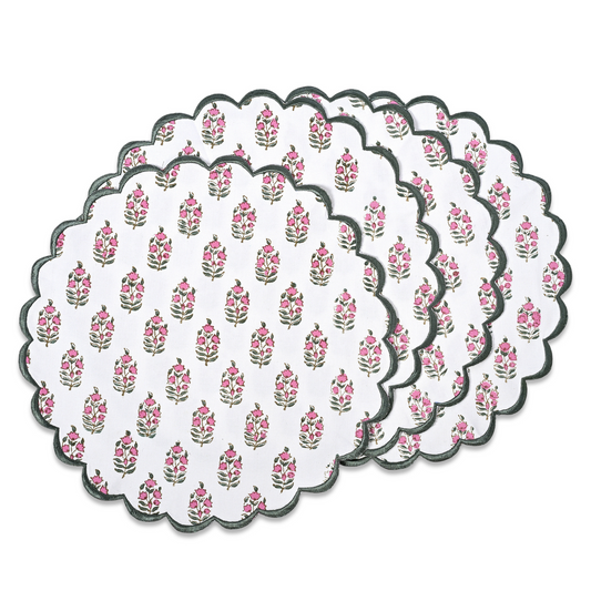 Set of round floral placemats with scalloped edge on a white background