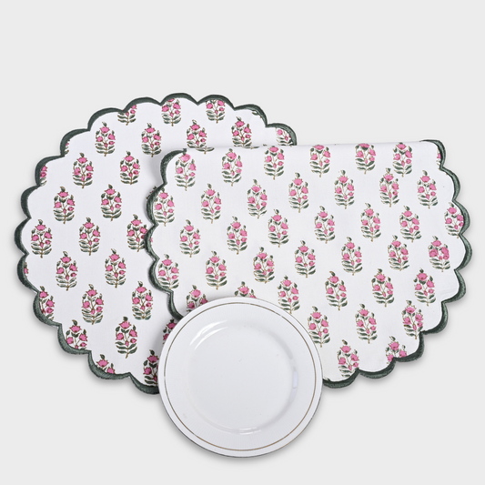 Set of floral patterned placemats on a white background