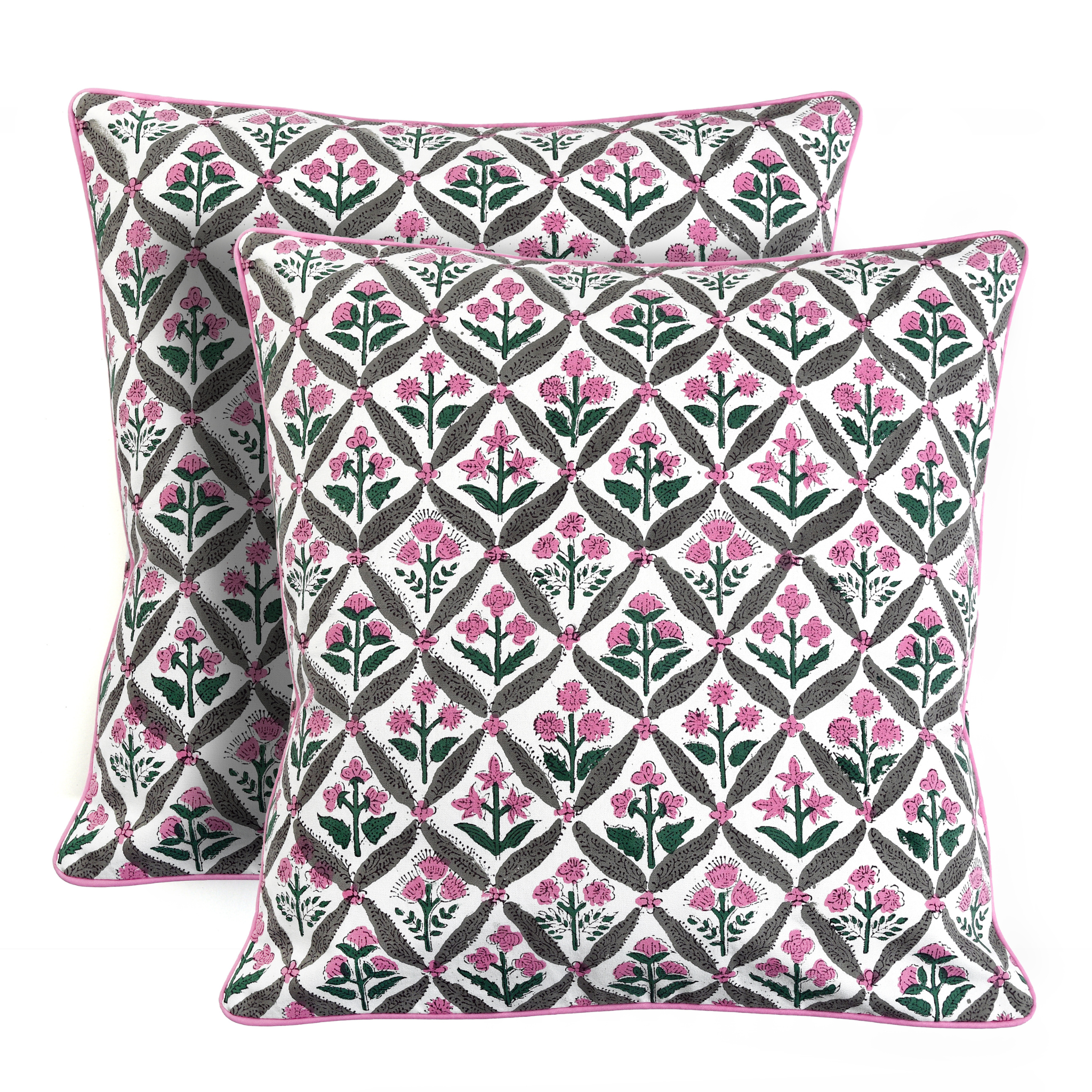 Two decorative pillows with a geometric floral pattern on a white background