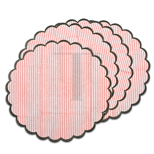 Set of pink textured circular coasters on a white background