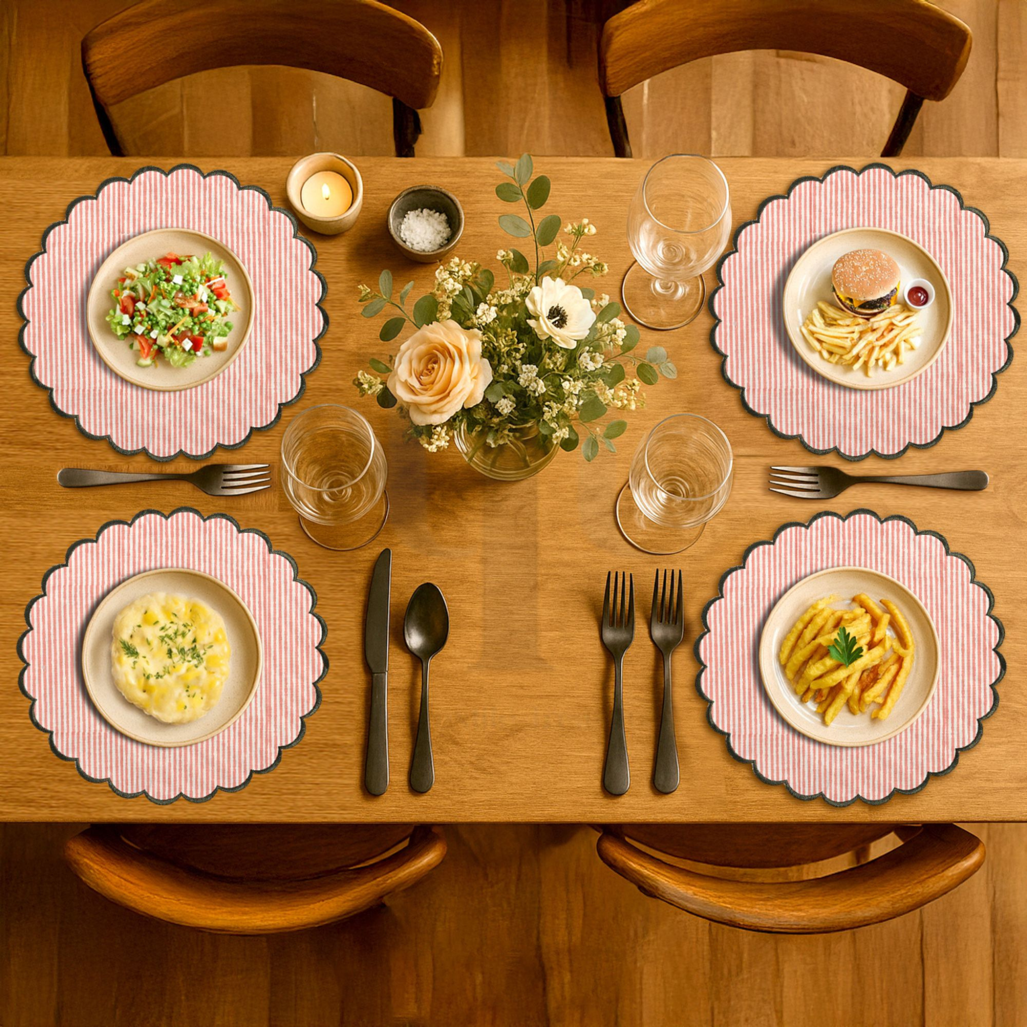 Dining table set with plates, glasses, cutlery, and a floral centerpiece.