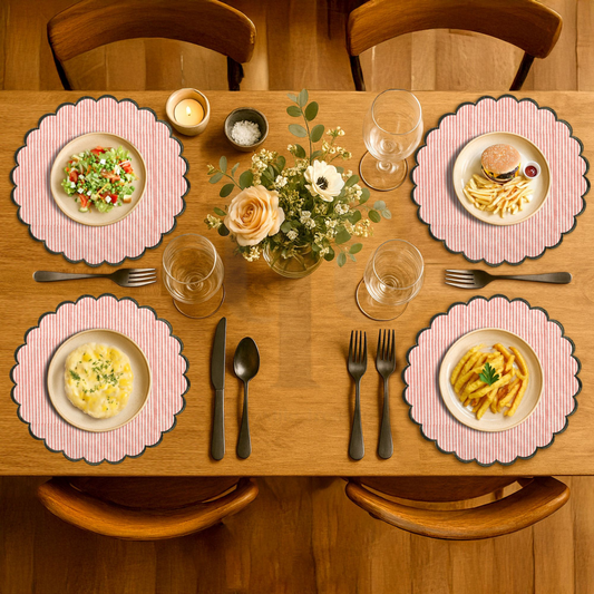 Dining table set with plates, glasses, cutlery, and a floral centerpiece.