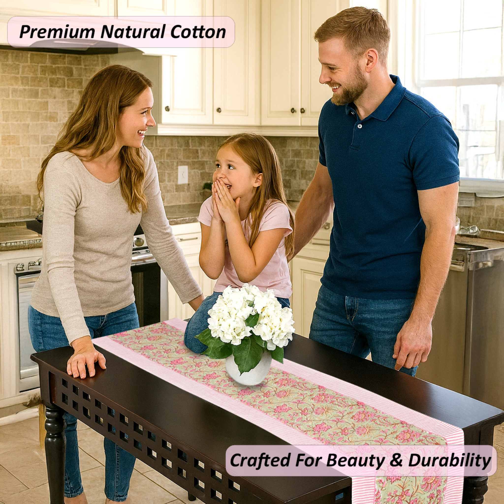 Family in a kitchen with a table runner featuring white flowers.