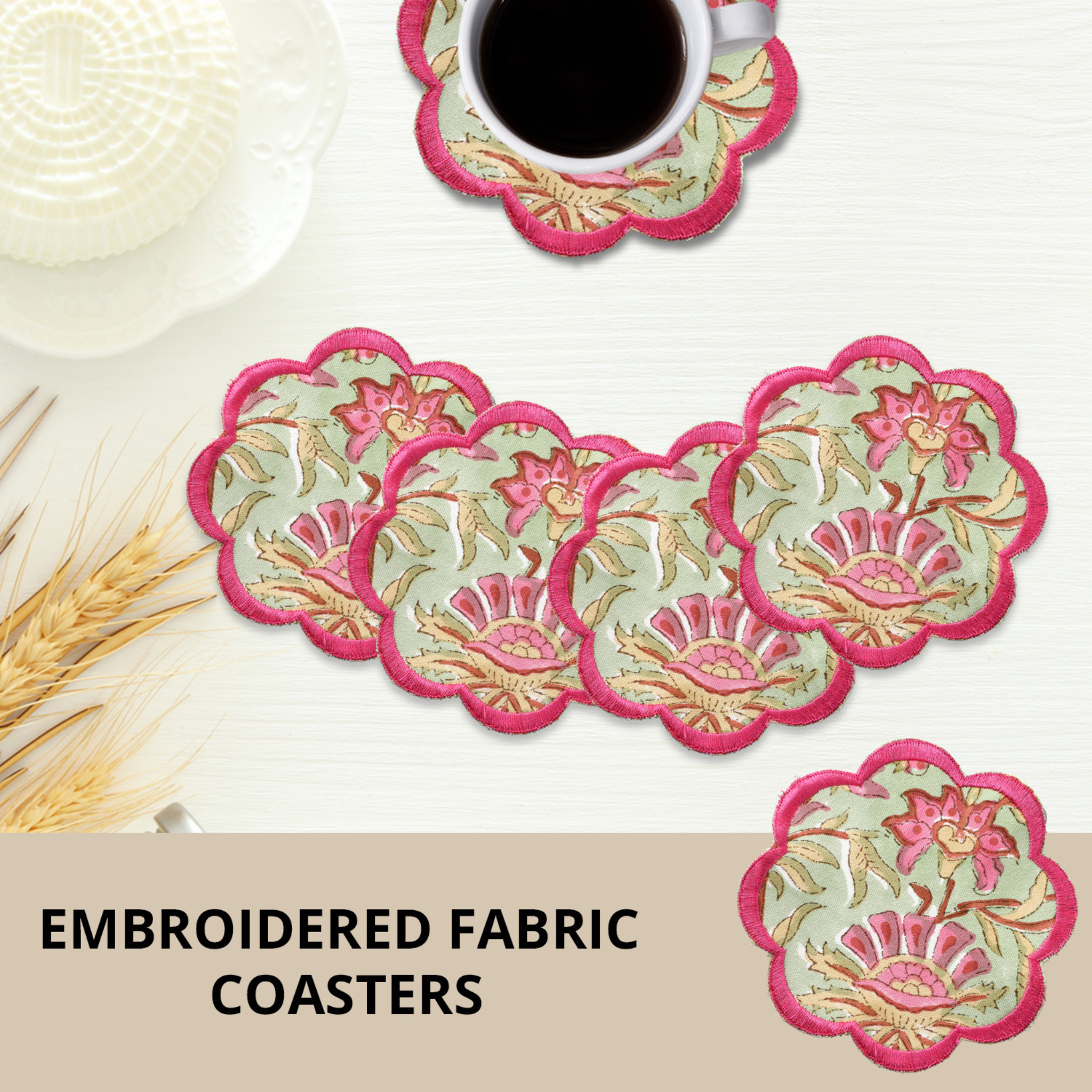 Set of embroidered fabric coasters with a cup of coffee on a white surface.