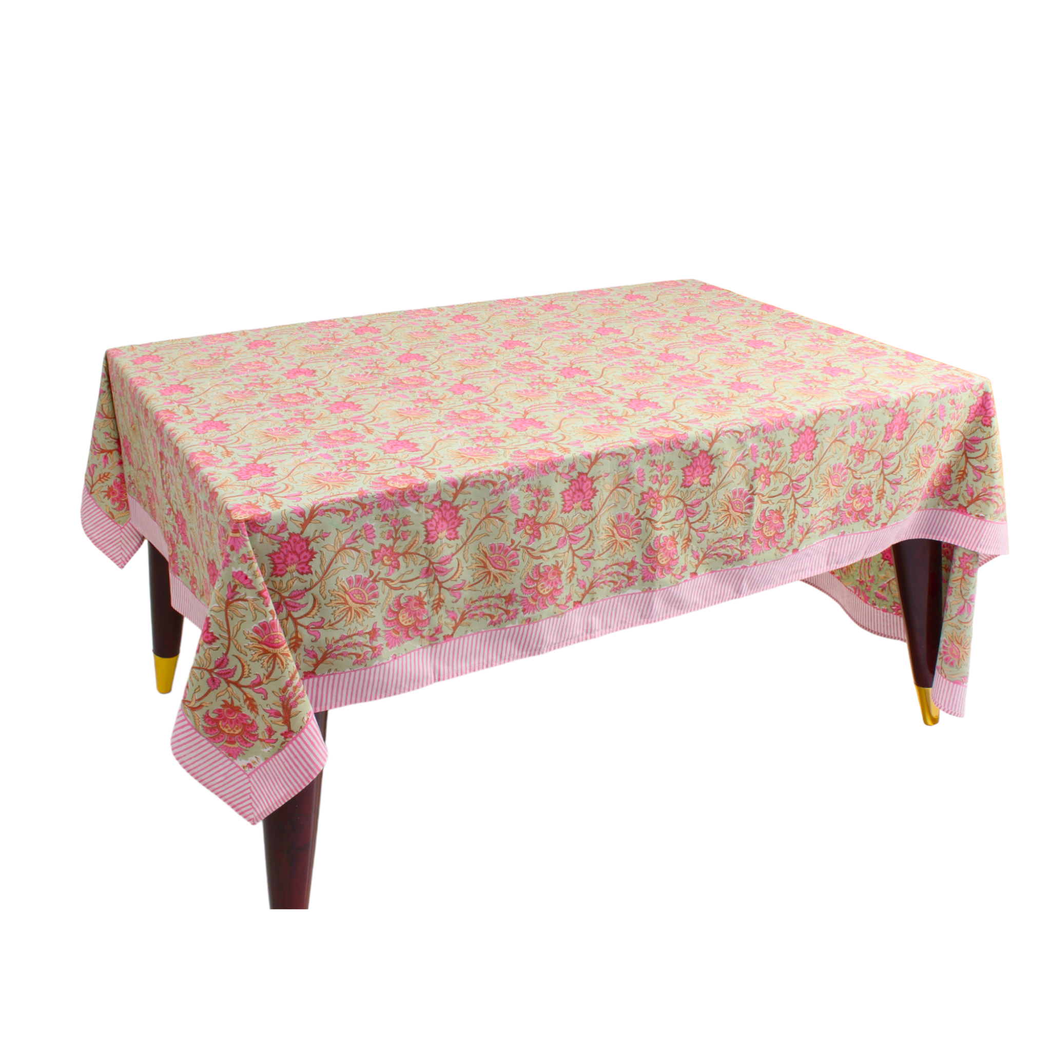 Floral patterned tablecloth on a wooden table with a white background