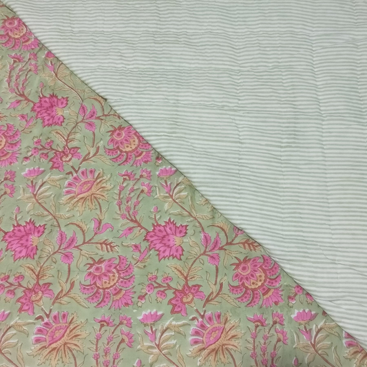 Fabric with pink floral pattern on a light green background