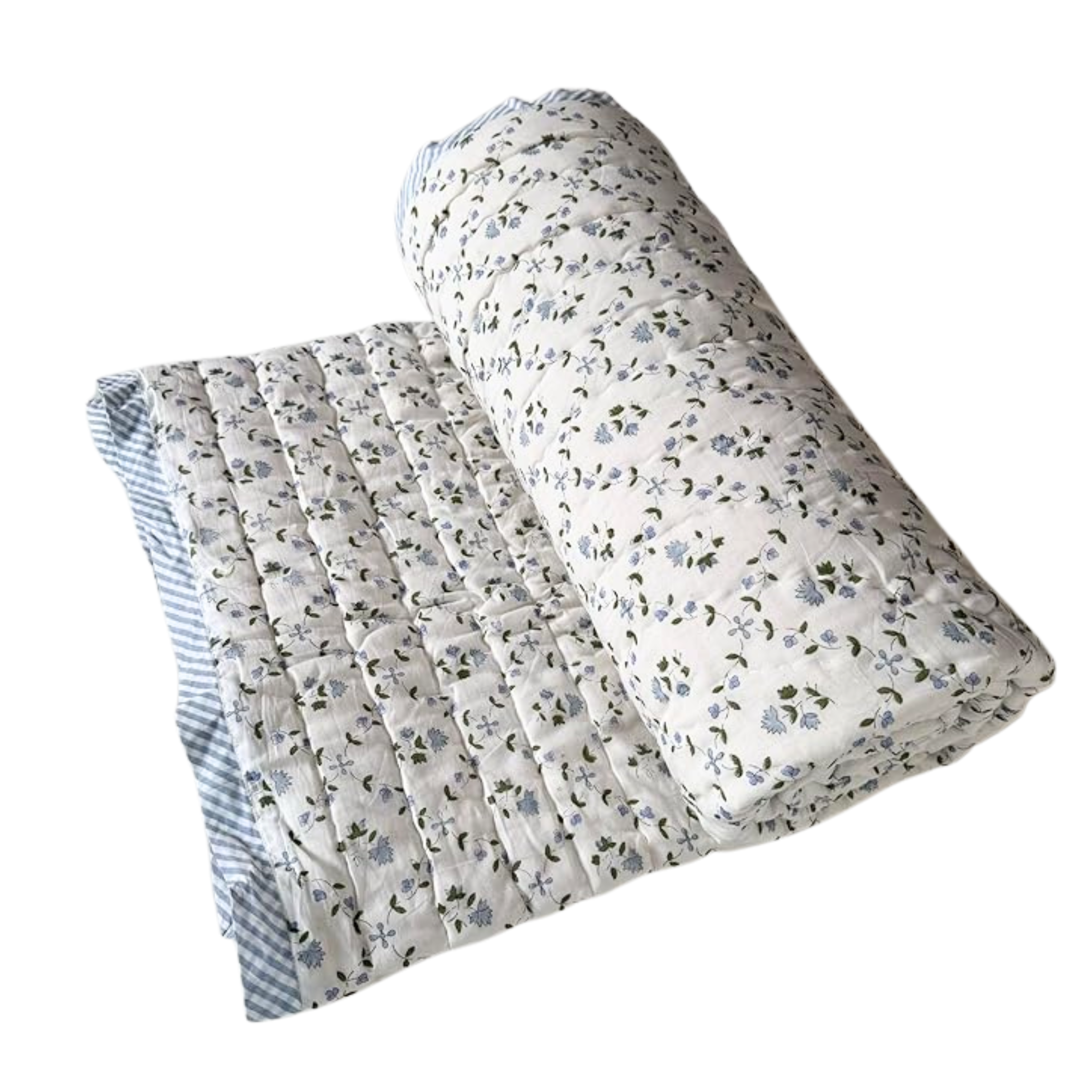 Floral-patterned quilt and pillow on a white background