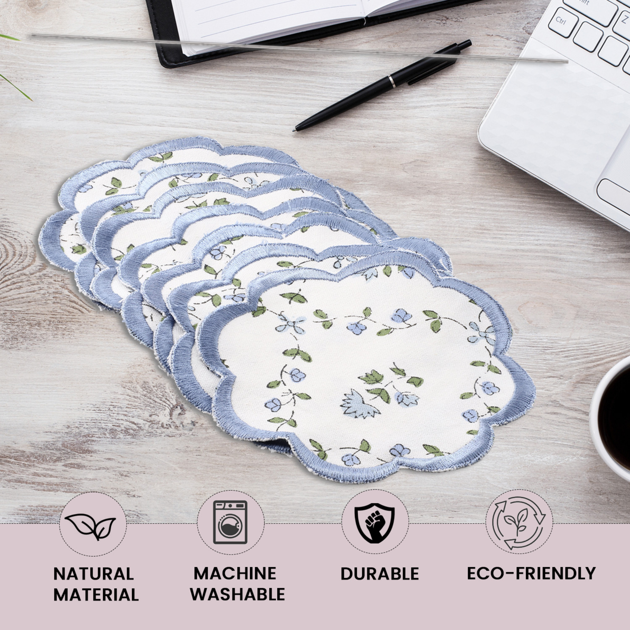 Set of reusable menstrual pads on a desk with icons indicating features like natural material, machine washable, durable, and eco-friendly.